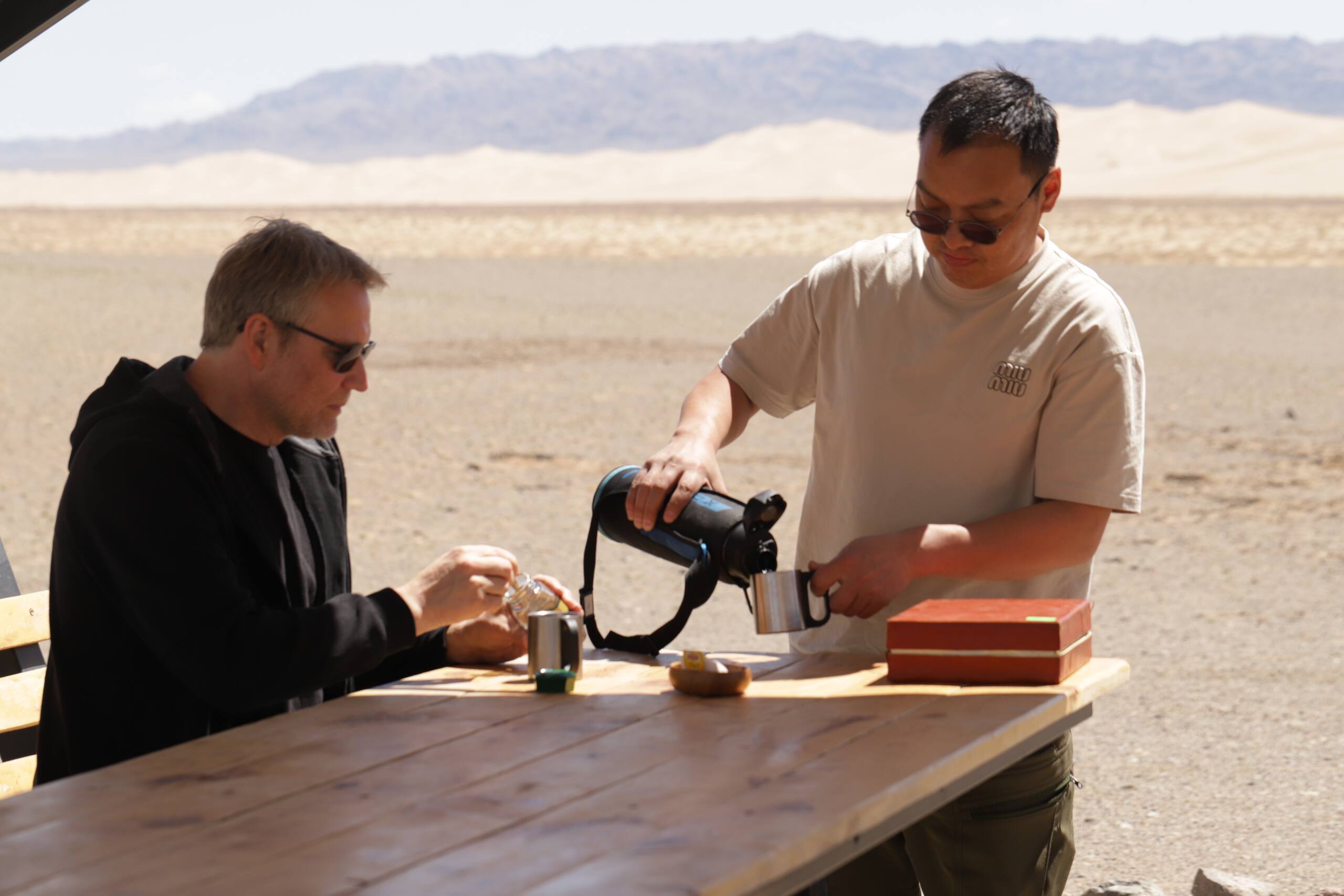 Local guide showing telescope and binoculars for wildlife observation