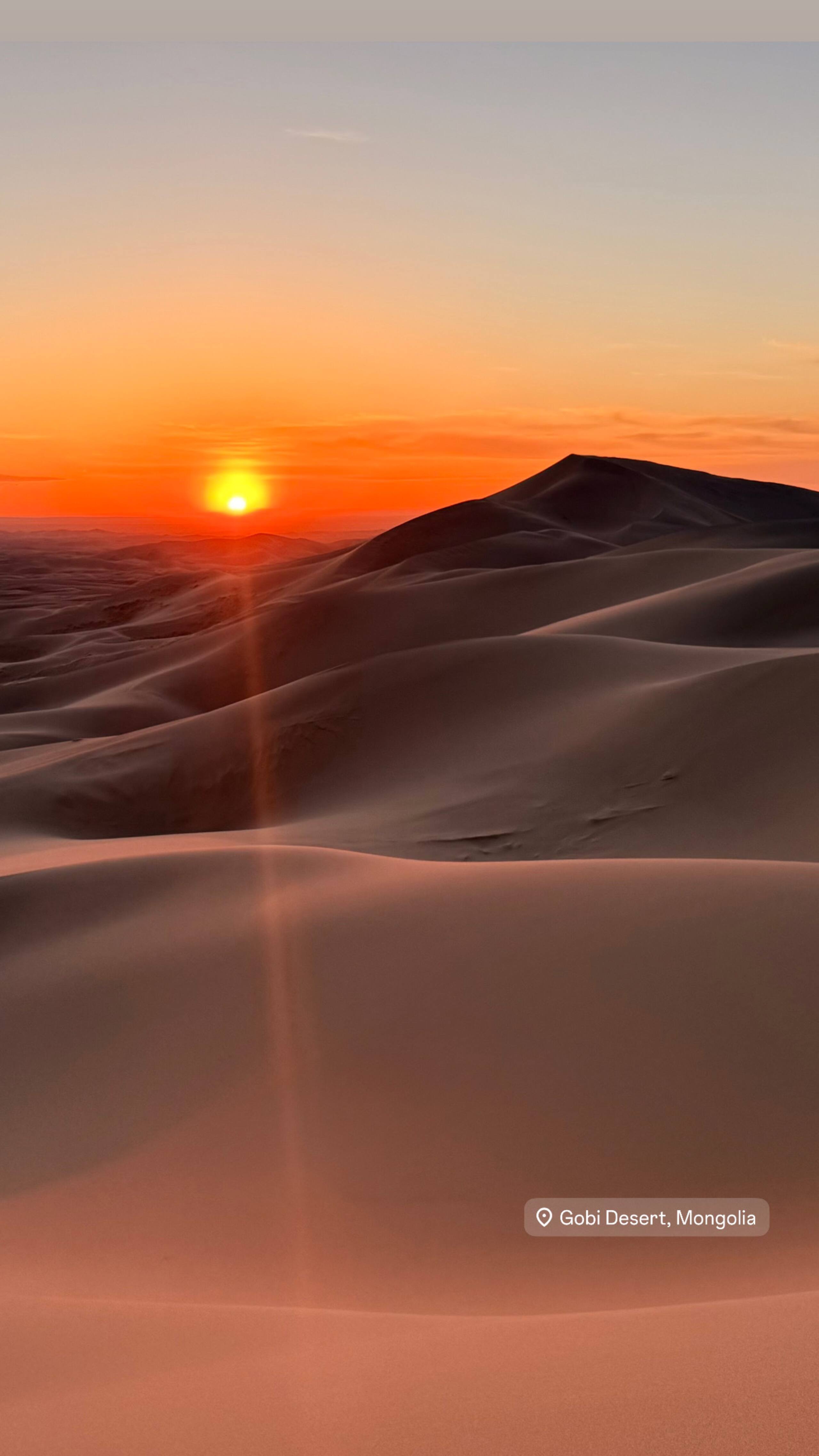 Stunning sunset over sand dunes in Khongoryn Els Gobi Desert