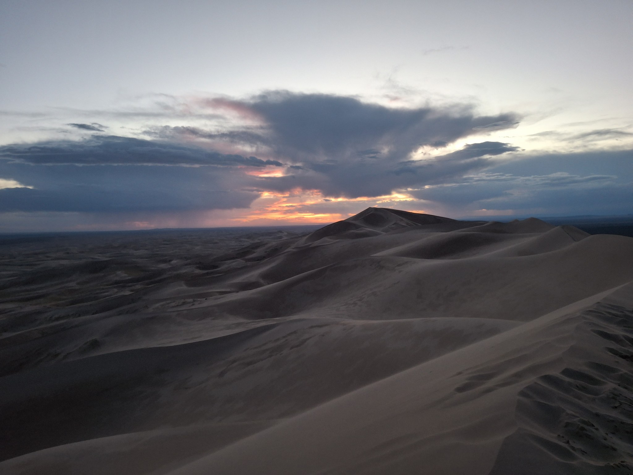 Khongor Sand Dunes glowing at sunset in the Gobi Desert